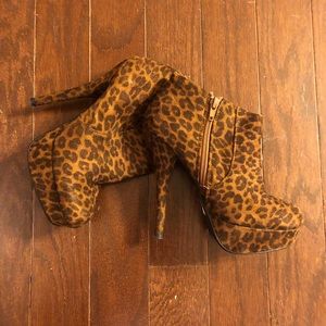 Leopard print heeled platform booties.